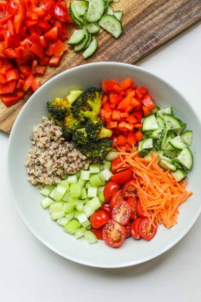 A vibrant bowl of fresh vegetables and quinoa, perfect for a healthy meal.